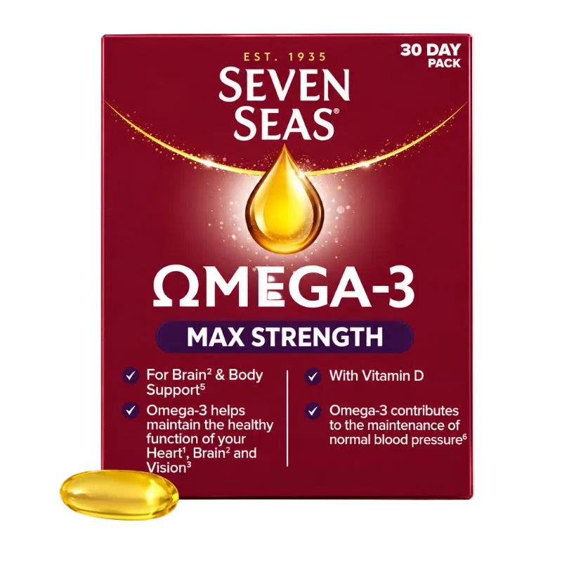 Seven Seas Omega-3 Max Strength supplement box in deep red with a gold oil drop graphic, plus one translucent yellow-green softgel capsule shown in front on a white background.