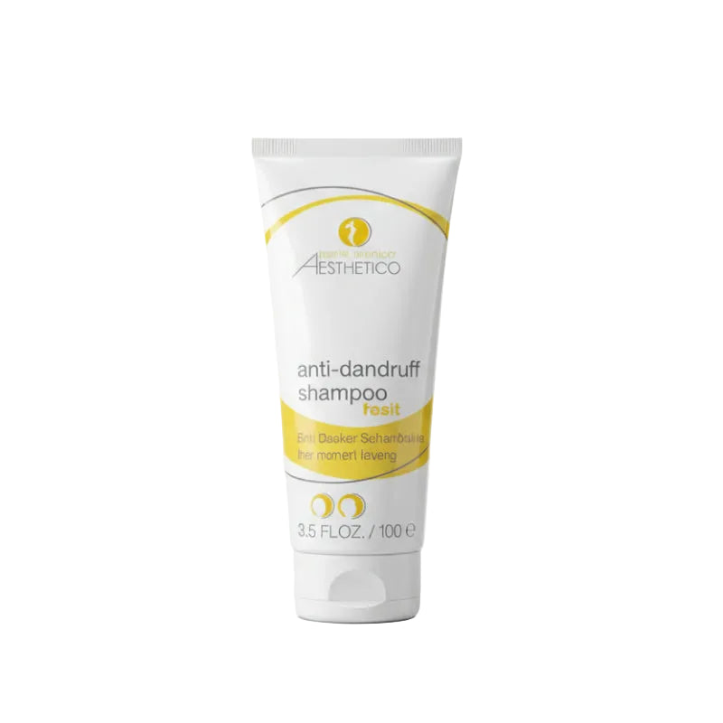 A tube of AESTHETICO ANTI-DANDRUFF SHAMPOO HEAD, predominantly white with yellow accents and green text, against a plain background.