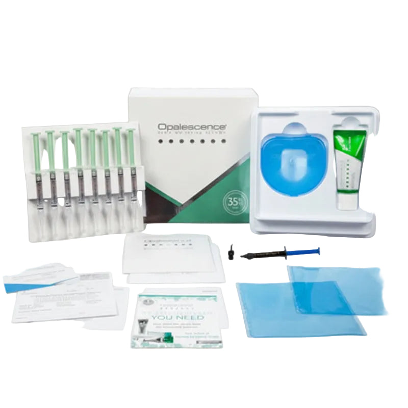 Dental product kit with various components on a gray background