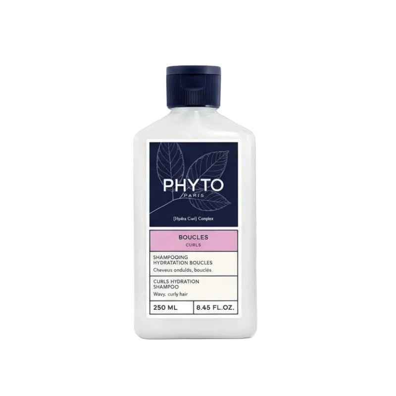 White shampoo bottle with navy cap and Phyto branding on a white background