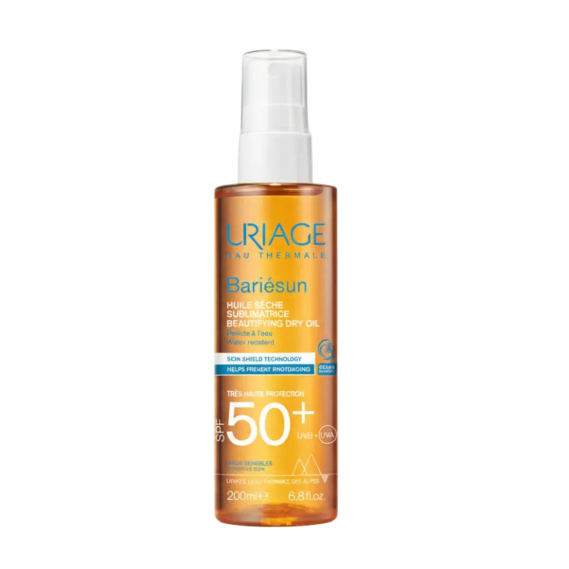Uriage Bariésun sun oil bottle with a blurred beach background
