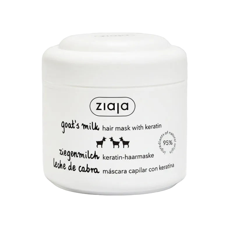 A white jar with a label displaying 'ZIAJA' brand, 'Goat's Milk Hair Mask with Keratin', and additional text indicating the product is for hair care. The jar contains hair mask powder for application.