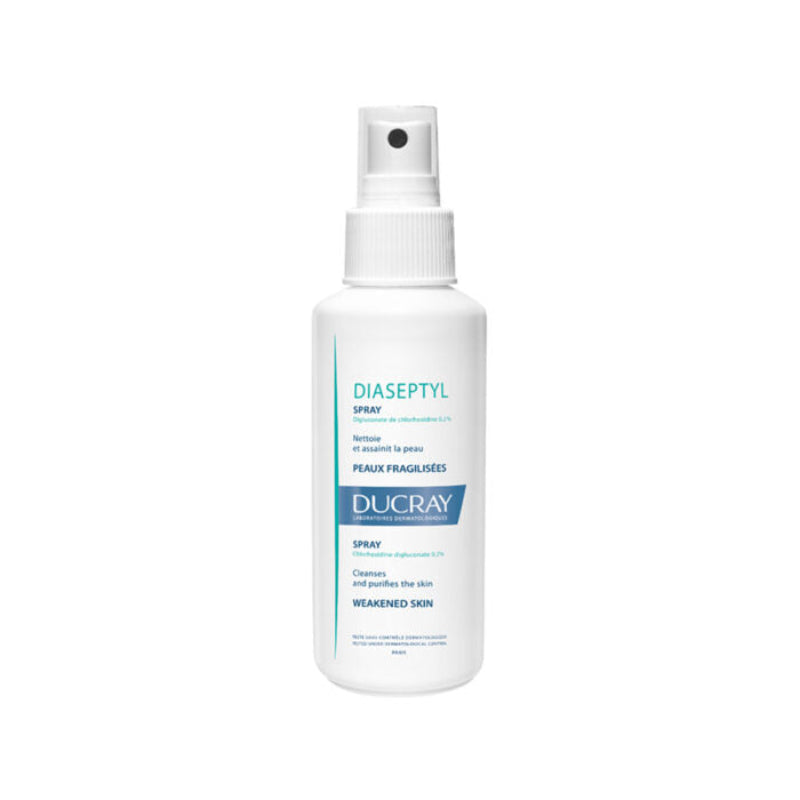 A bottle of Ducray Diaseptyl Spray with a white label and blue accents, designed for antiseptic purposes on the skin.
