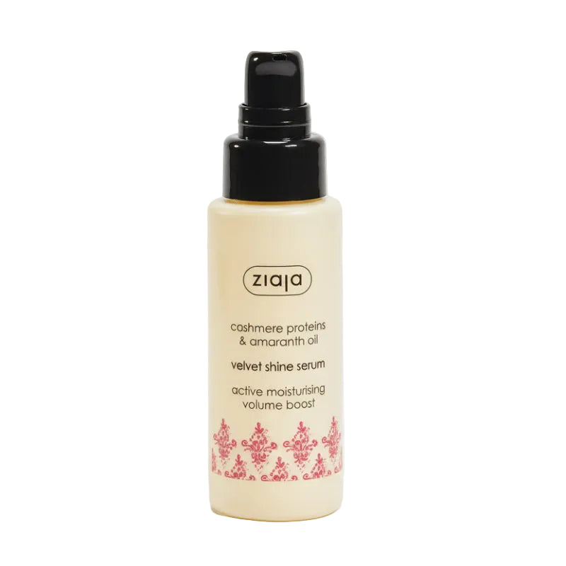 Bottle of ZIAJA cashmere protein and amaranth oil hair serum with a pump dispenser, labeled in a clear and elegant font with pink floral graphics.